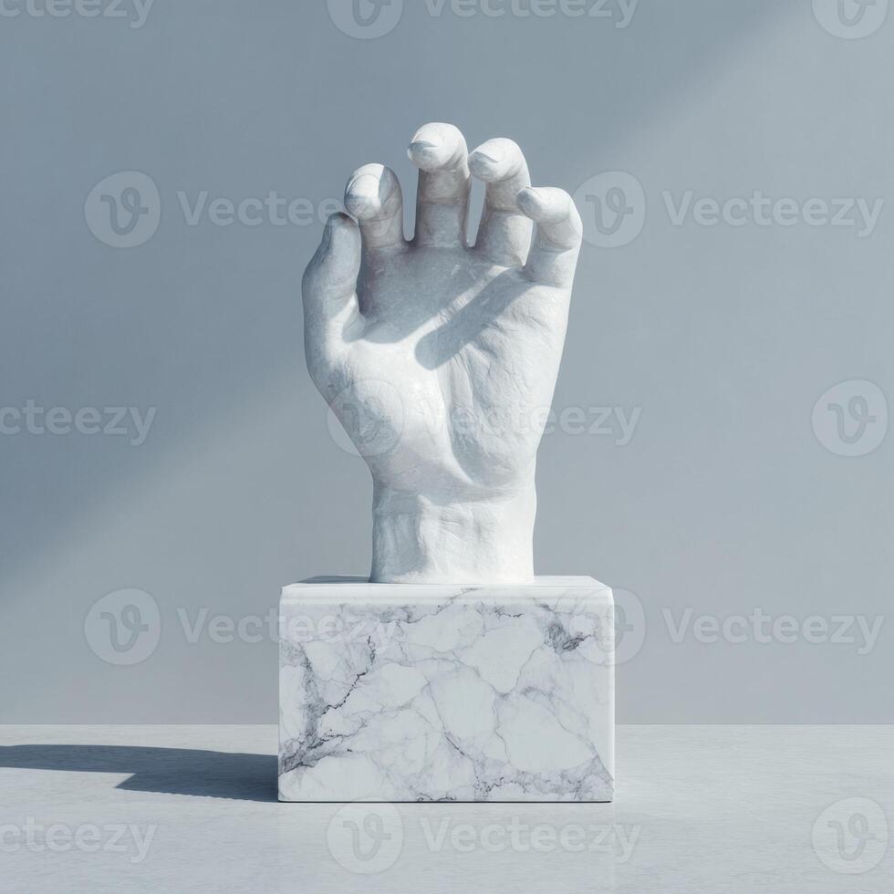A white marble statue of a hand on a table photo