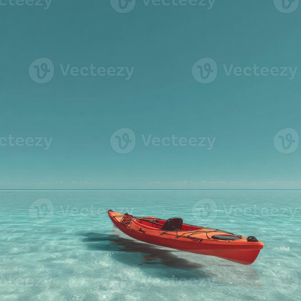 A red kayaks floating in the ocean photo