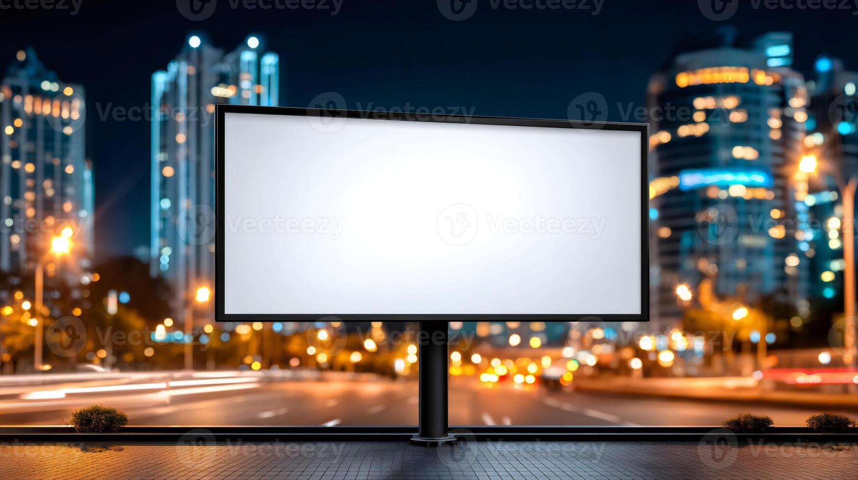 Blank billboard displaying advertising message on city street at night photo