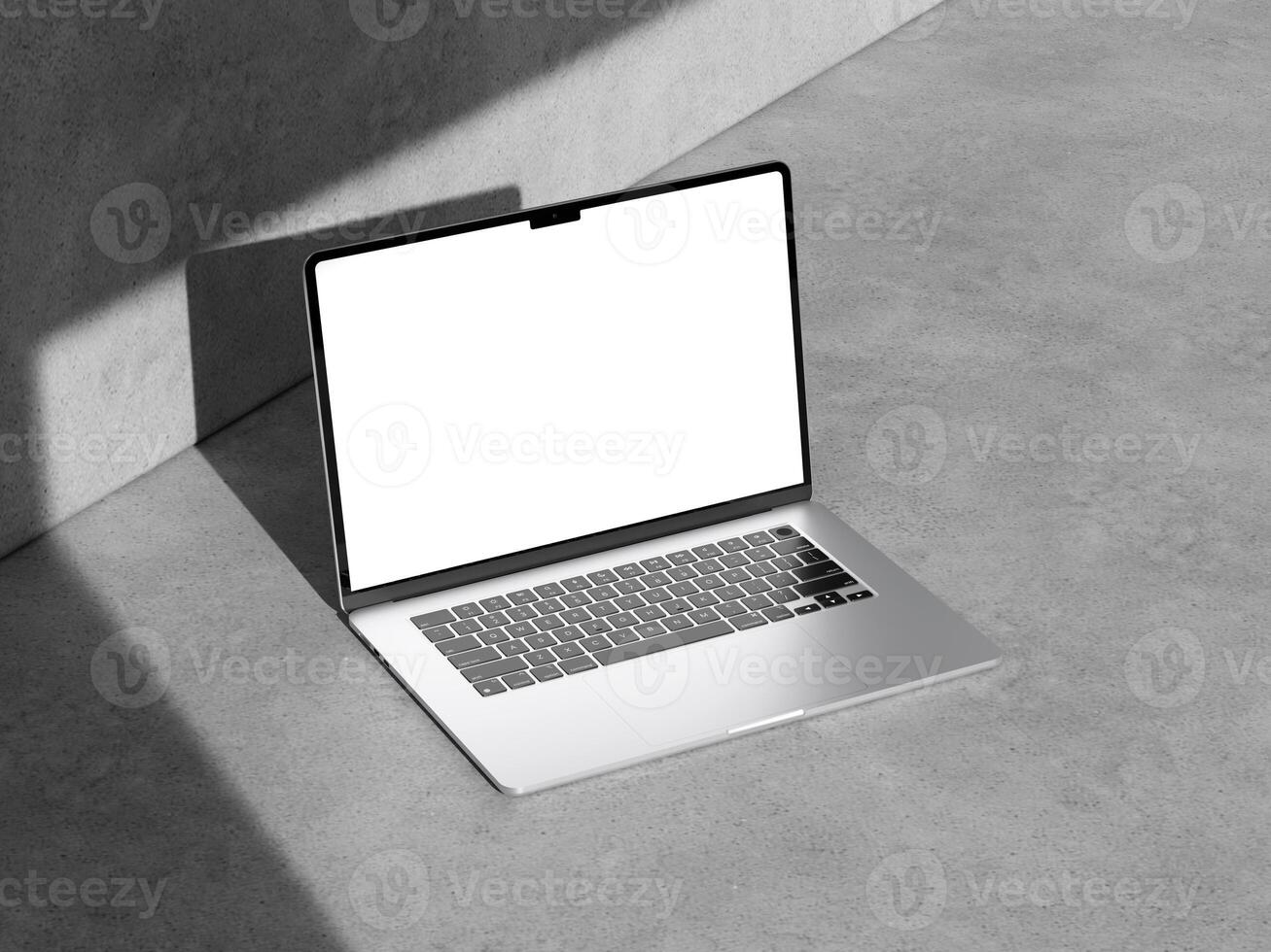 Minimalist laptop mockup on textured cement, providing a contemporary and clean look for design use. photo