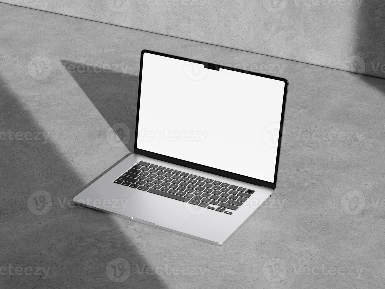 Stylish laptop mockup on a rough cement surface with a minimalist aesthetic, perfect for tech and business designs. photo