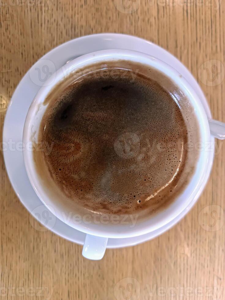Top view black cup black coffee on wooden background cafe restaurant Morning routine coffee breakfast photo