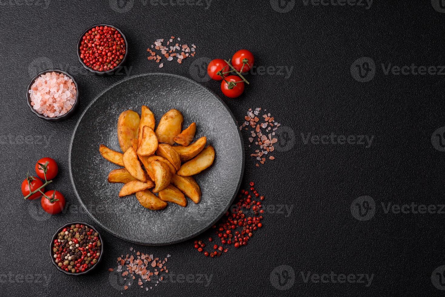 Grilled potato wedges with rosemary, salt and spices. Baked potato slices photo