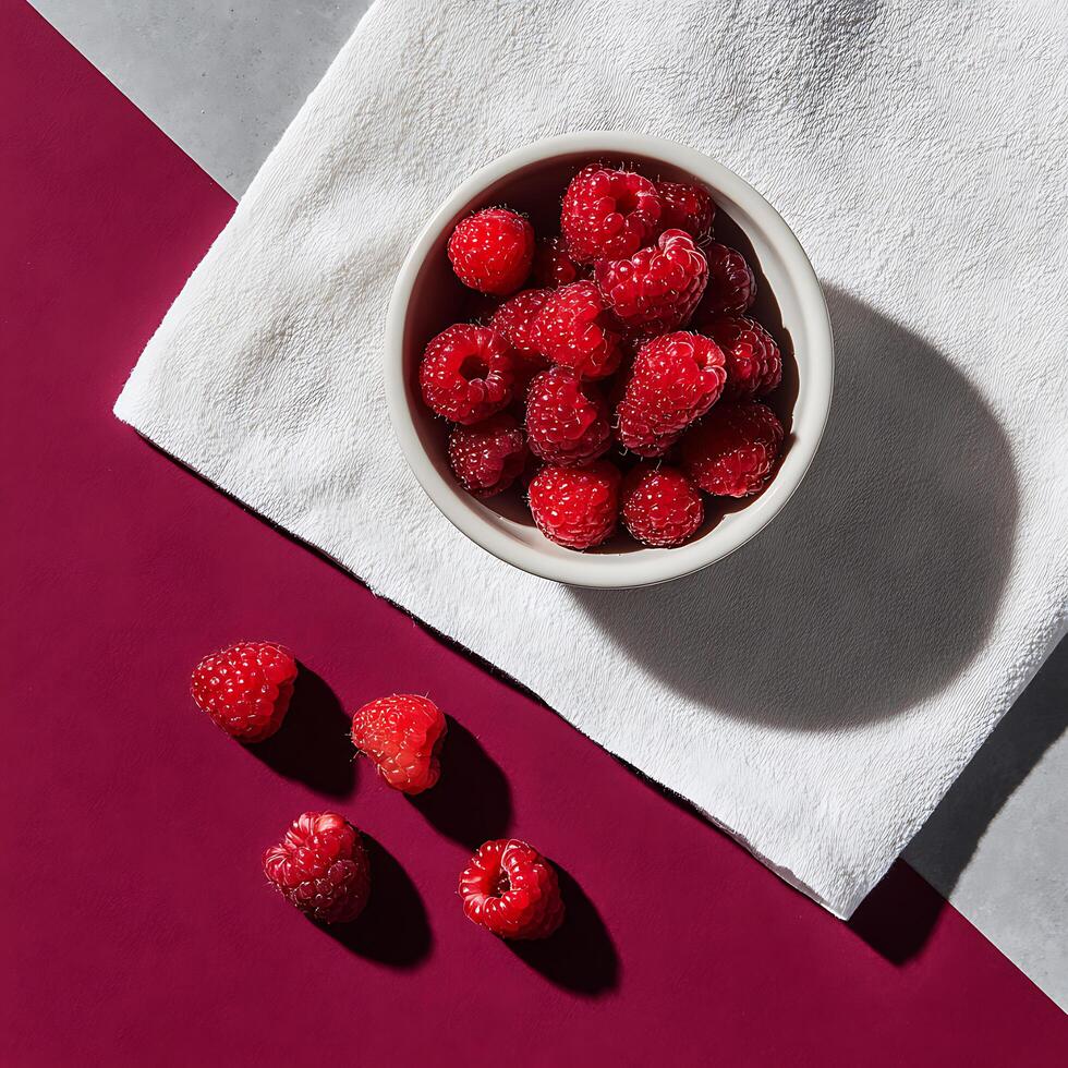 A small bowl filled with raspberries photo