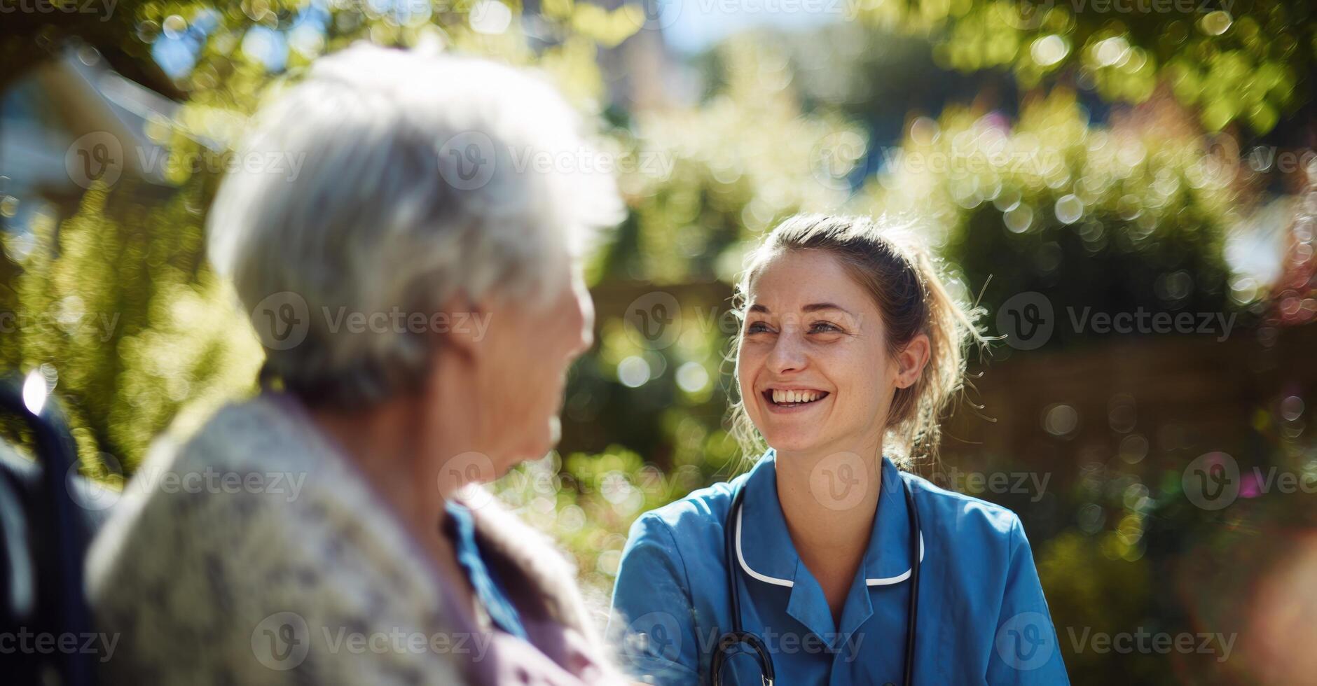 A nurse talking to an older woman photo
