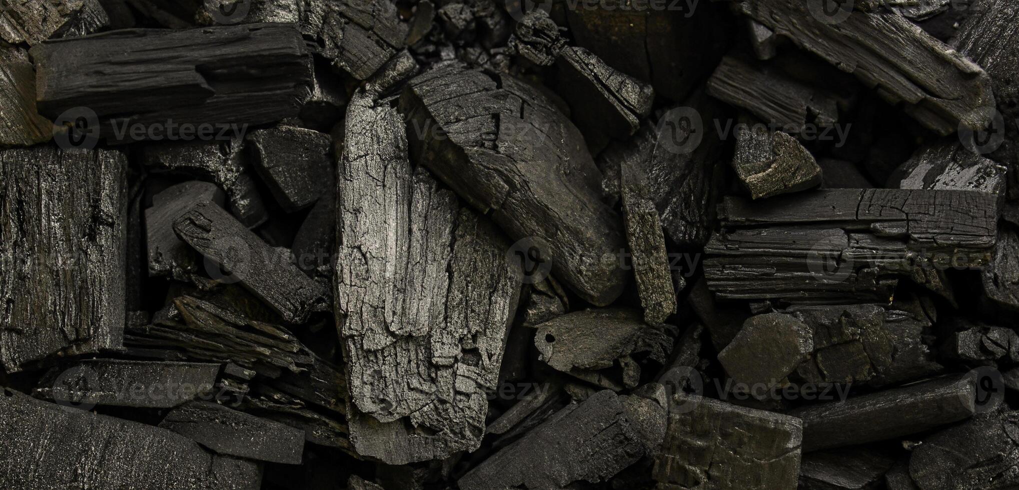 Charcoal Wood Pieces Close-Up Texture Background photo