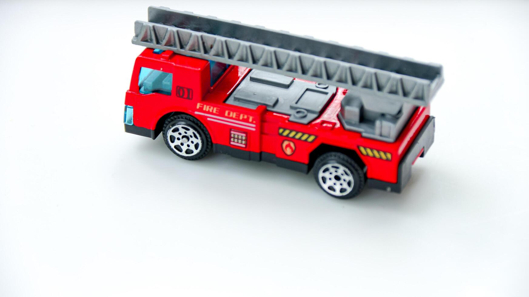 Toy Firetruck with Ladder Model on White Background photo