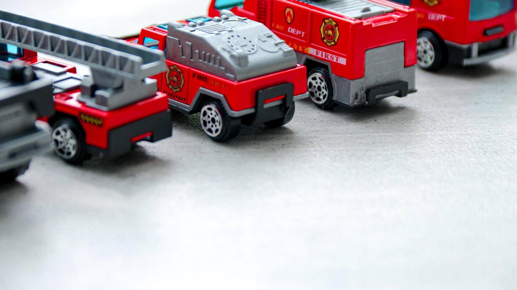 Toy Firetrucks in a Row Close Up photo