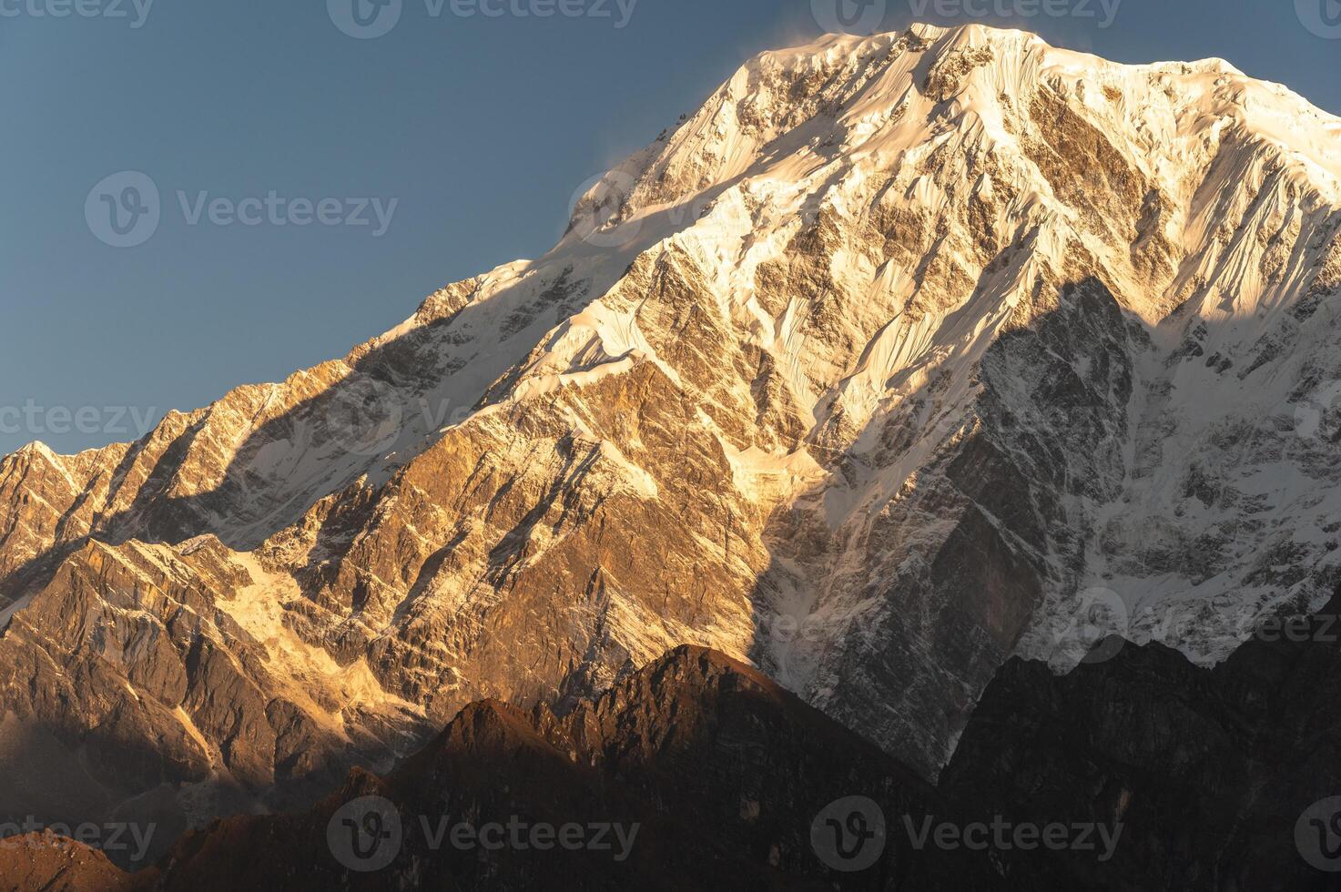 View of Mt.Annapurna South 7,219 m at dawn seen from Mardi Himal view point in the Annapurna region of Nepal. photo