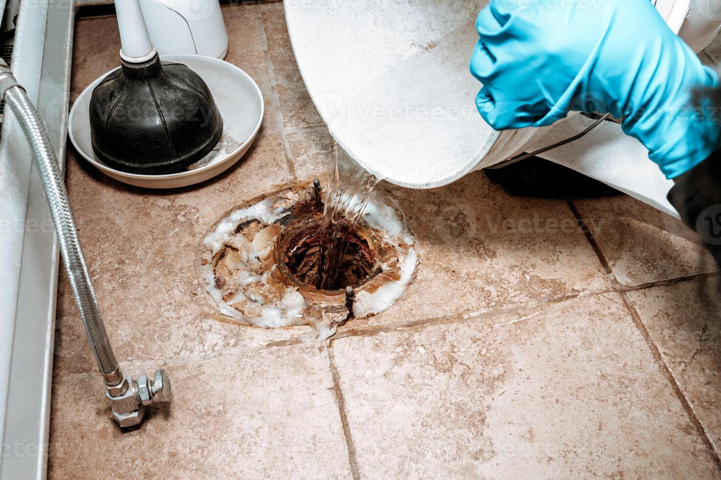 Professional plumber replacing old wax ring photo