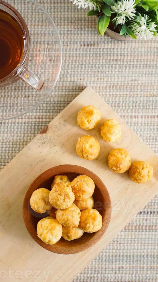 Cheese balls in a wooden bowl photo