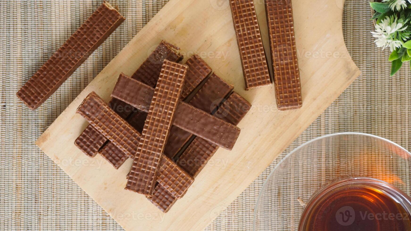 Chocolate wafer snacks on wooden board photo