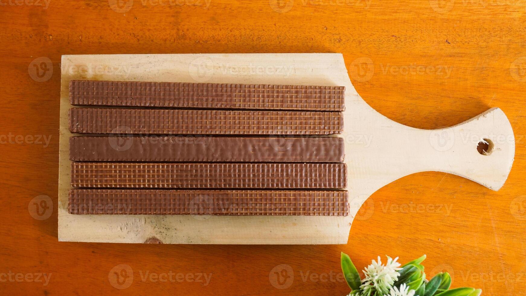 Choco wafer sticks on wood photo