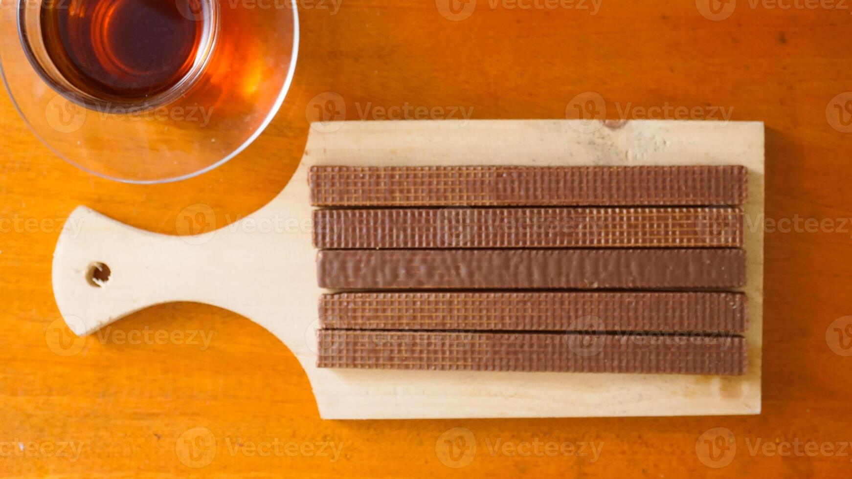 Chocolate bars and cup of tea photo