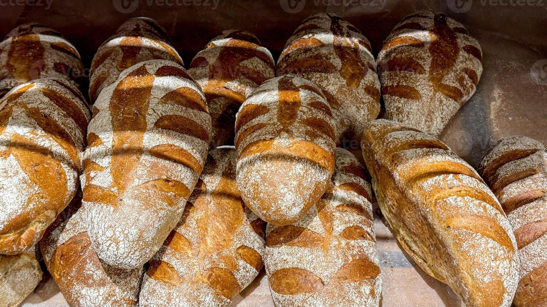 Golden crusty sourdough loaves, evoking ancestral harvest festival vibes, bakings ancient ritual, Lammas celebration of cornucopian abundance photo