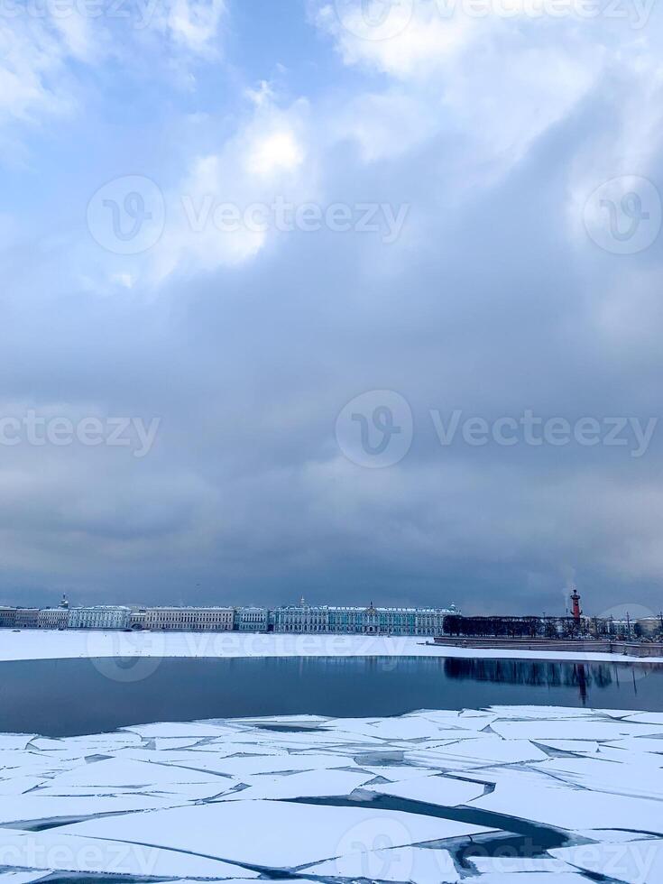 Frozen lake with fragmented ice under a brooding sky, evoking Winter Solstice introspection and serene Nordic mystery photo