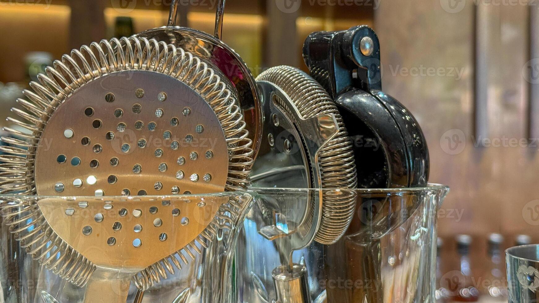 Shimmering bar tools poised like metallic guardians, cocktail craftsmanship, World Bartender Day, mixology magic in celebratory alchemy photo