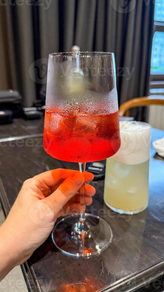 Chilled scarlet elixir glistens in a glass, perfect for midsummer revelries or whimsical Lunar New Year toasts photo