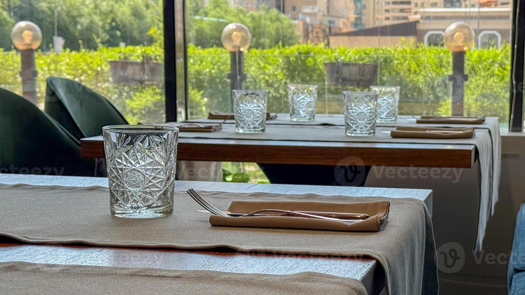 Elegant urban brunch setting with geometric glassware, capturing the serenity of a midsummer afternoon, perfect for Earth Day reflections photo