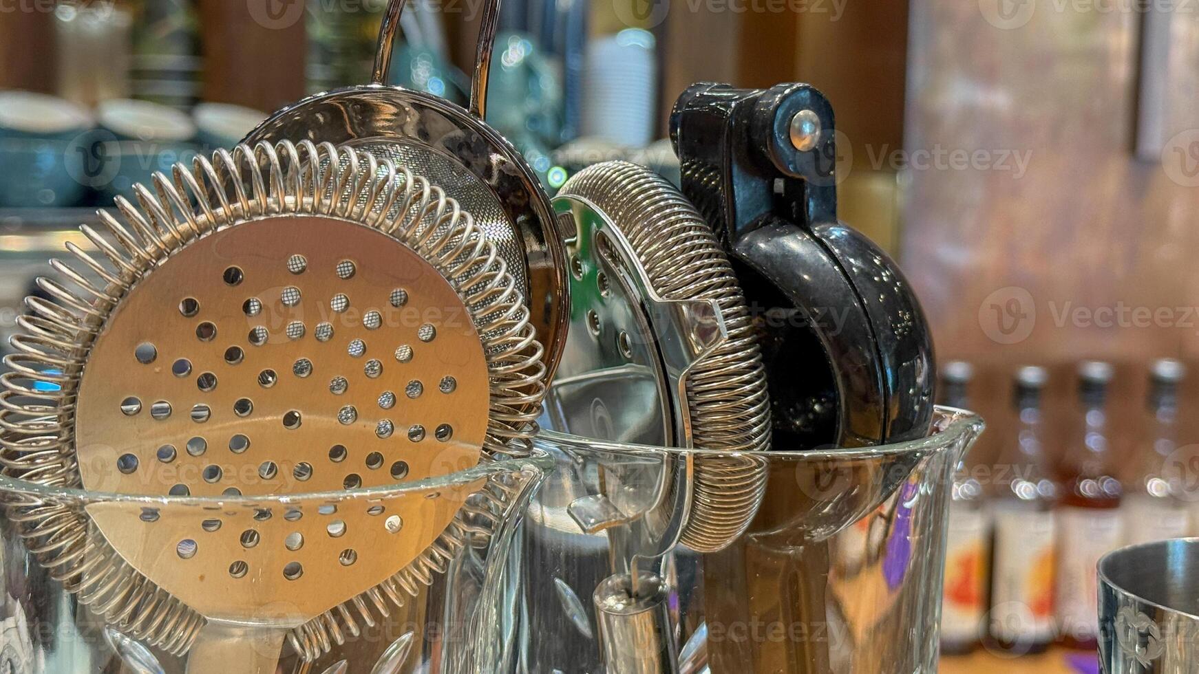 Gleaming cocktail strainers and shakers exude winter solstice merriment, hinting at hidden speakeasy whispers and Wren Day revelry photo