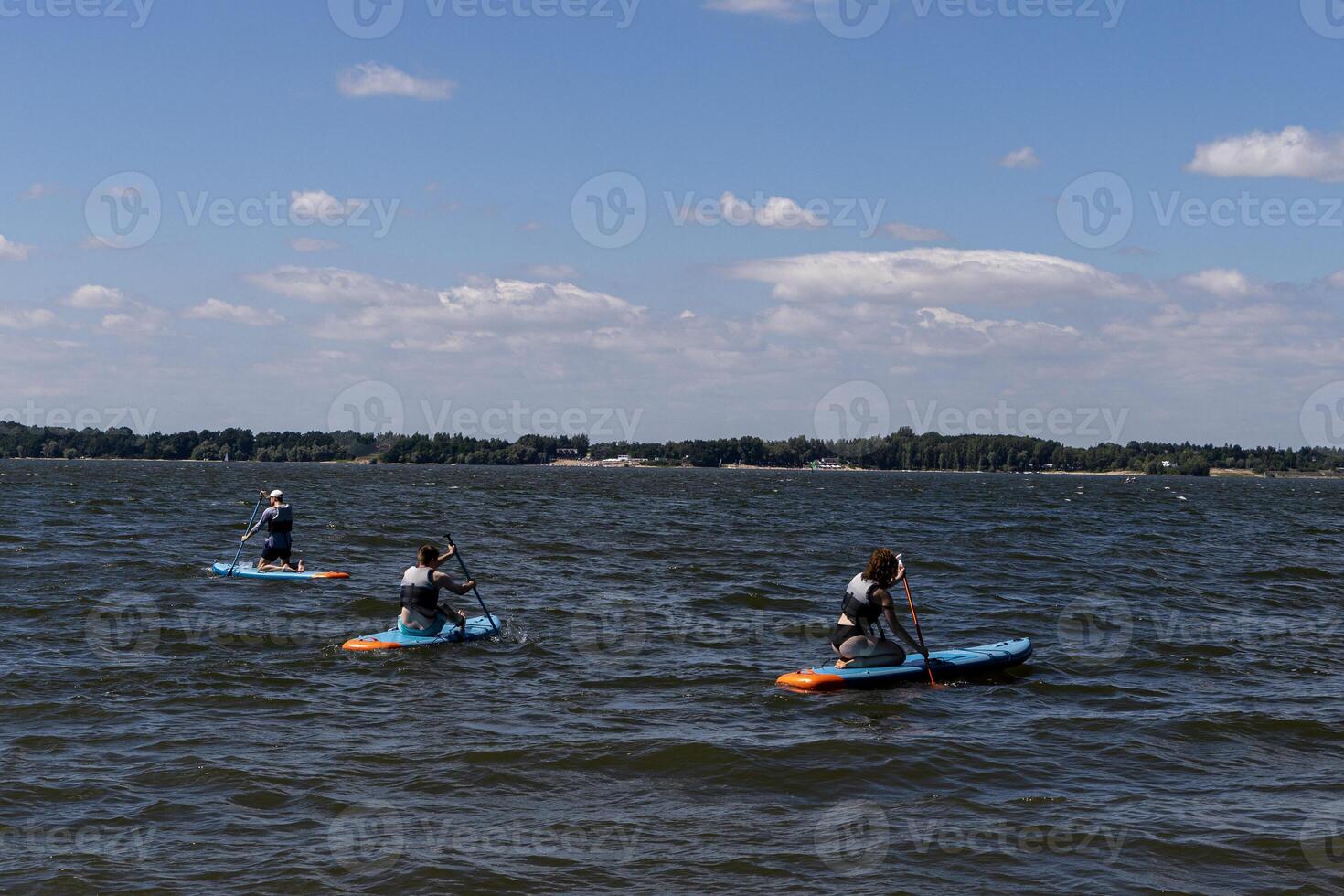 SUP touring group on Mitkow Bay, Poland. Landscape. photo