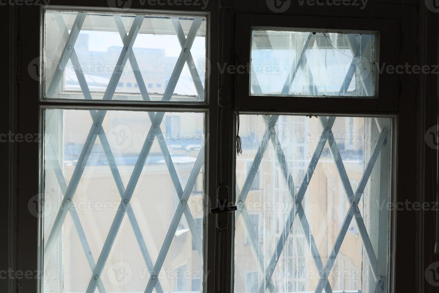 Exploring Geometric Window Design Featuring an Intricate Cross Pattern for Aesthetic Appeal photo
