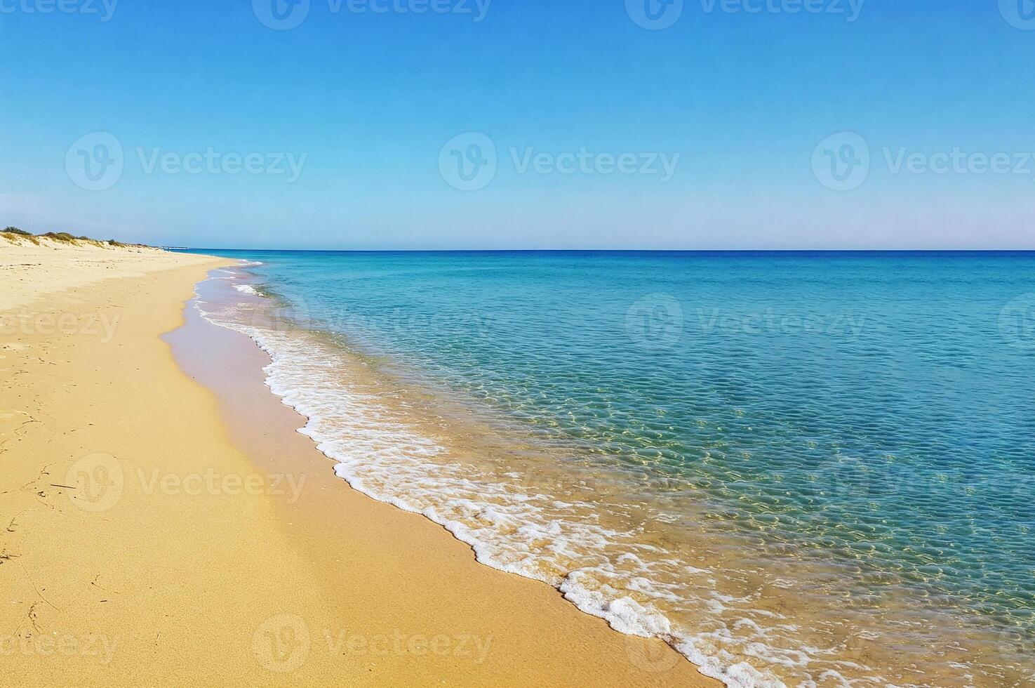 Aerial view of endless sandy beach with crystal clear turquoise water and clear blue sky, perfect atmosphere for rest and relaxation. For travel, vacation, nature, summer, serenity and coastal themes. photo