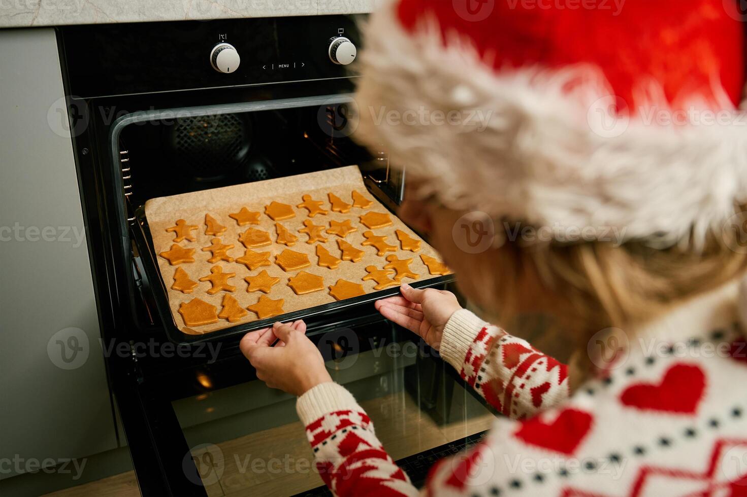 Woman baking Christmas cookies photo