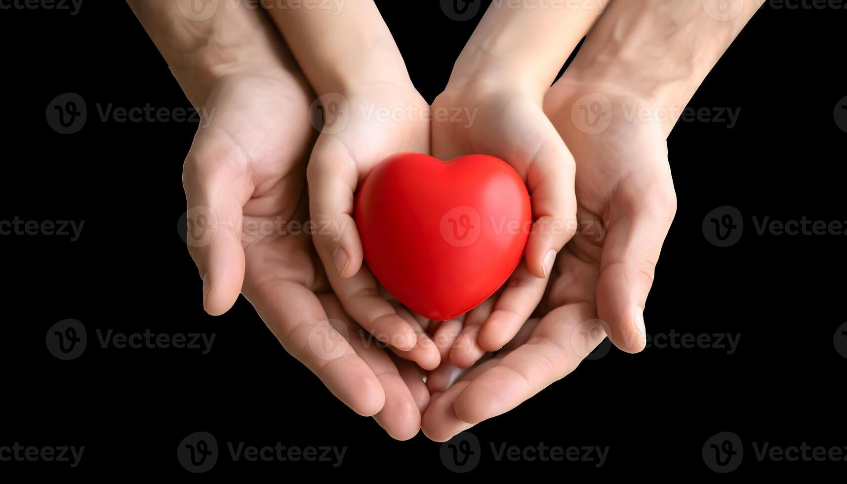 Top view of adult and child hands holding a red heart. Concept of family love, healthcare, organ donation, hope, and charity. Parent protecting a child's health and future. photo