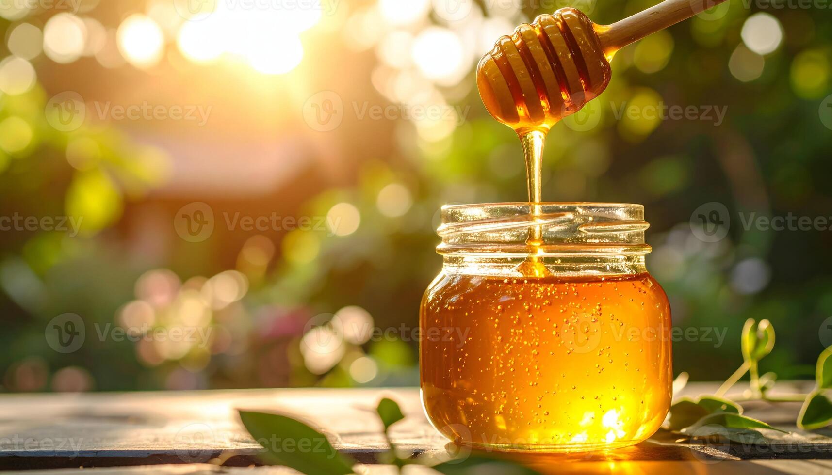 Honey jar with honey dipper photo