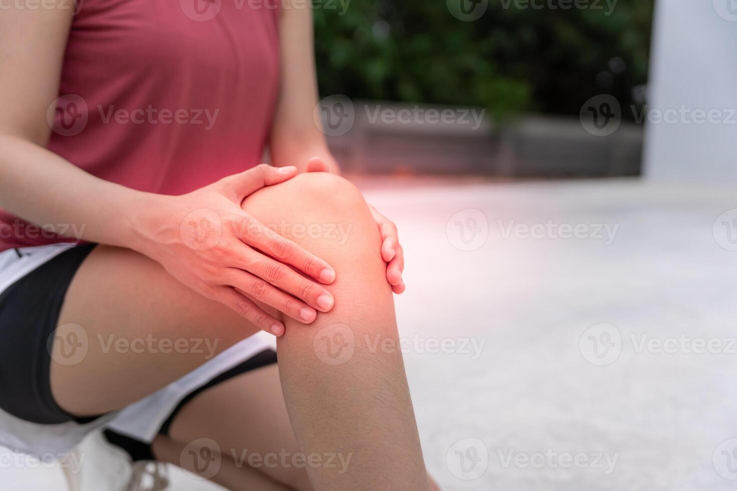 female athlete or spot woman having knee injury due to ligament inflammation, knee pain due to exercise, massage, muscle relaxation, rheumatoid arthritis gait disturbance, rheumatoid arthritis. photo
