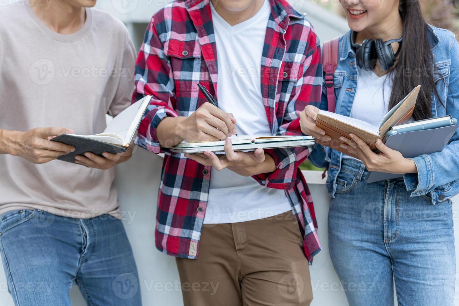 Group Asian student meeting team for work project. team happy study. Read book in college campus. Group on international Asia University. Education, study, school, college, graduation photo