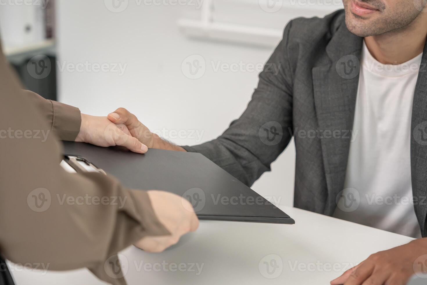 Manager senior sexually harassed a female colleague by touch her hand. Sexual harassment in office. feel anxious and stressed from being harassed. molest, assault, inappropriate, discrimination photo