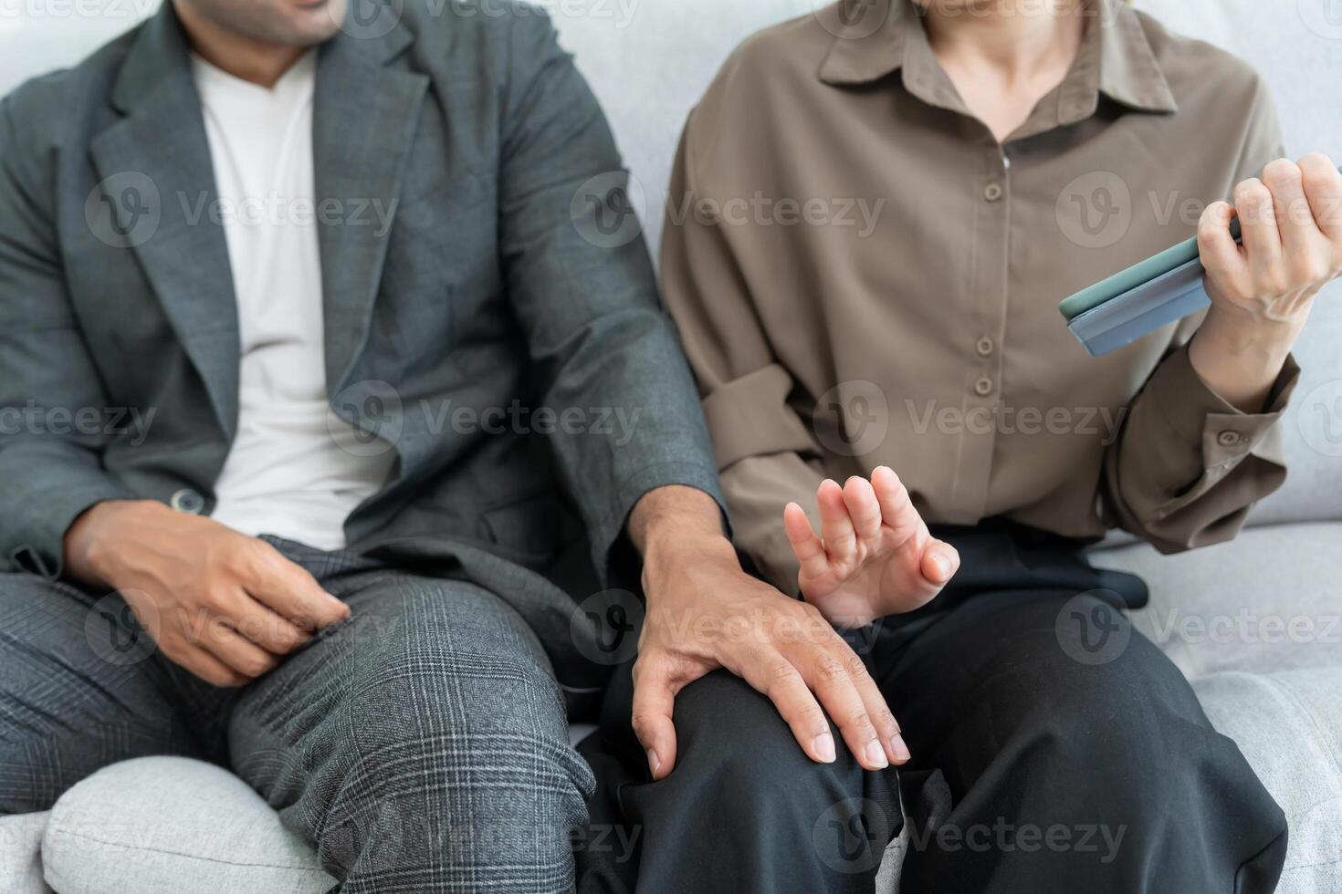 Manager or senior sexually harassed a female colleague by touch her leg. Sexual harassment in office. feel anxious and stressed from being harassed. molest, assault, inappropriate. photo