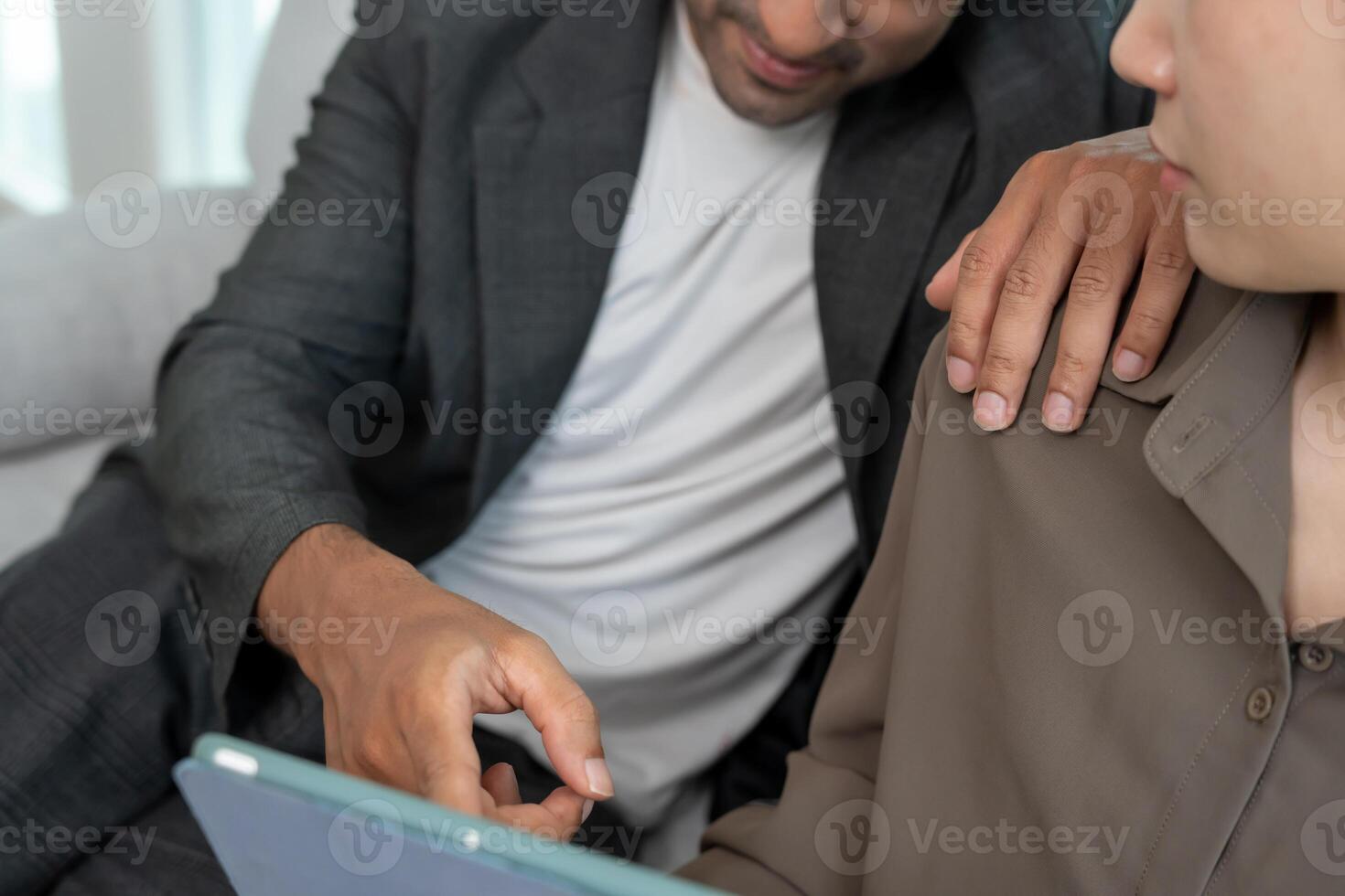 business man sexually harassed a female colleague by touch her shoulder. Sexual harassment in office. Women feel anxious and stressed from being harassed. molest, assault, inappropriate. photo