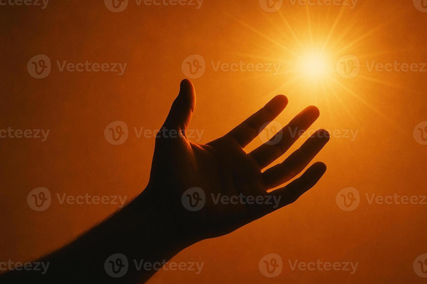 image of a hand reaching towards glowing light symbolizing strength hope and courage under adversity photo