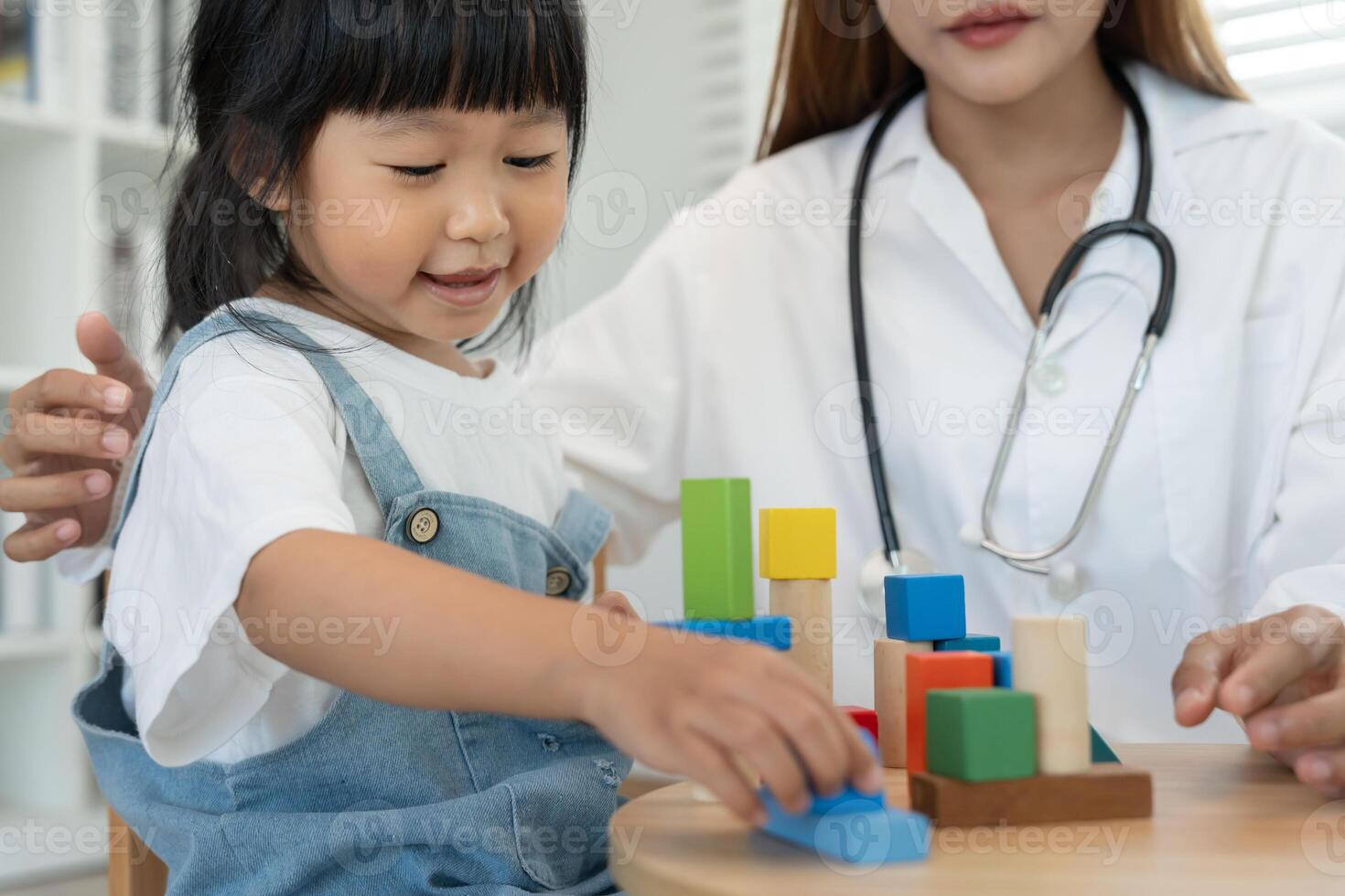 Pediatricians are checking the children development according to the appropriate age, doctors encourage the child to do activities, IQ, EQ, age appropriate learning activities and promotion. photo