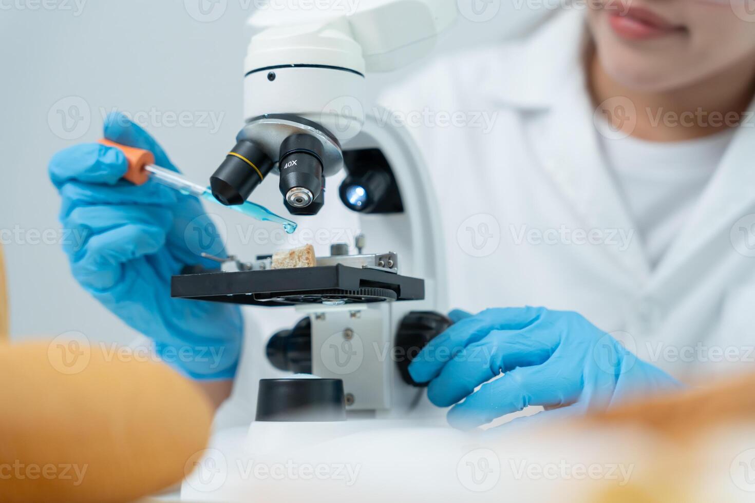 Scientist analyze biochemical samples in advanced scientific laboratory. Medical professional use microscope look microbiological developmental of viral Biotechnology research science lab, photo