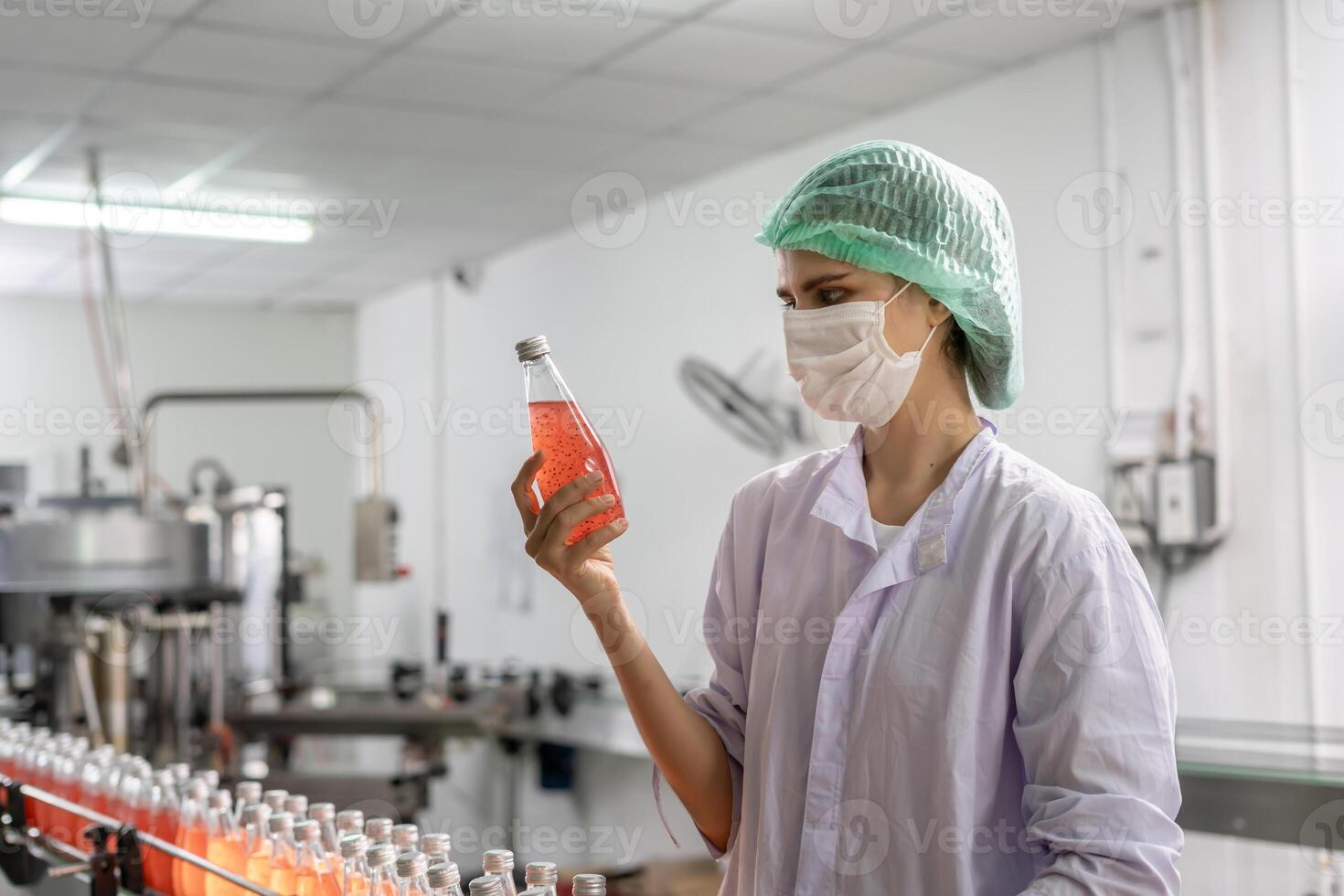 supervisor food or beverages technician inspection about condition control food or beverages before send product to the customer. Production leader recheck machine and productivity. photo