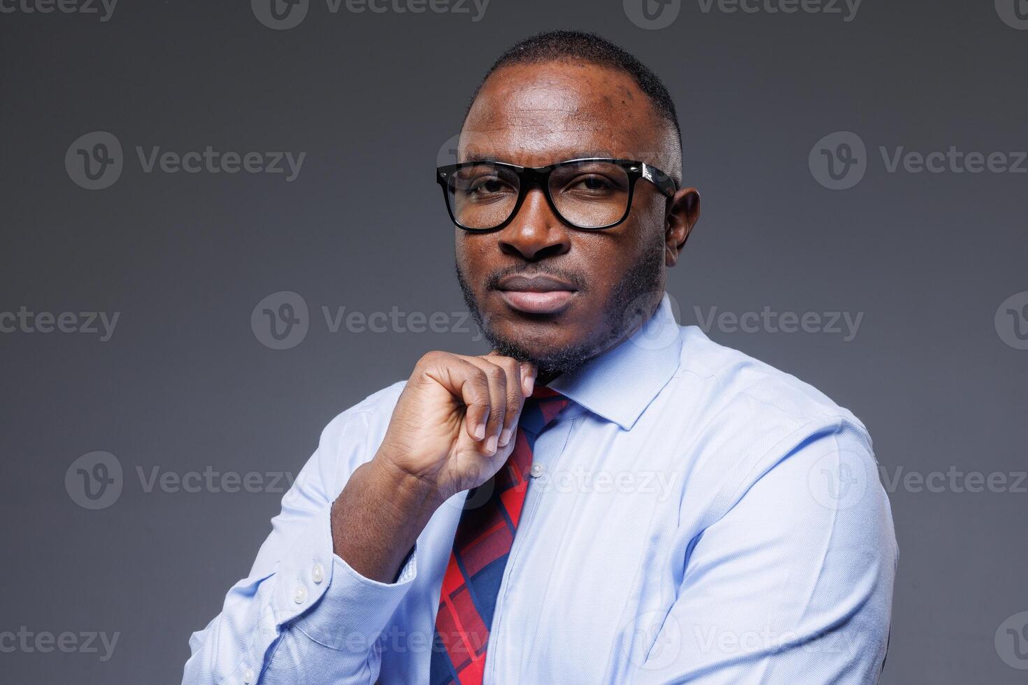 Confident Successful African Businessman in Formal Attire Thinking and Planning, Leadership and Strategy photo