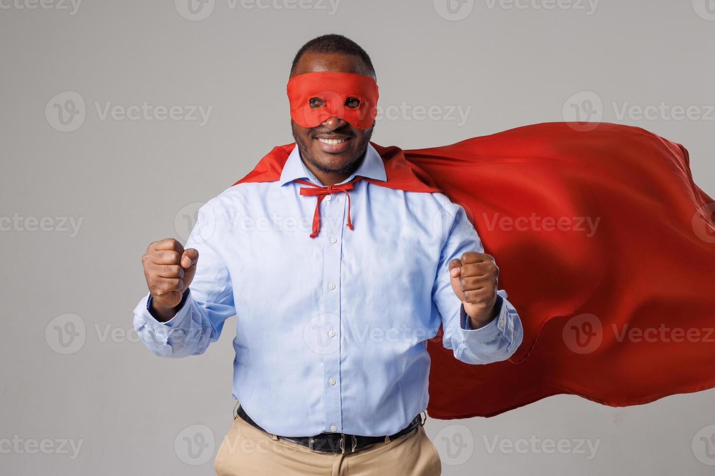 Confident Man with Red Cape and Mask Standing Strong as Symbol of Leadership and Motivation photo