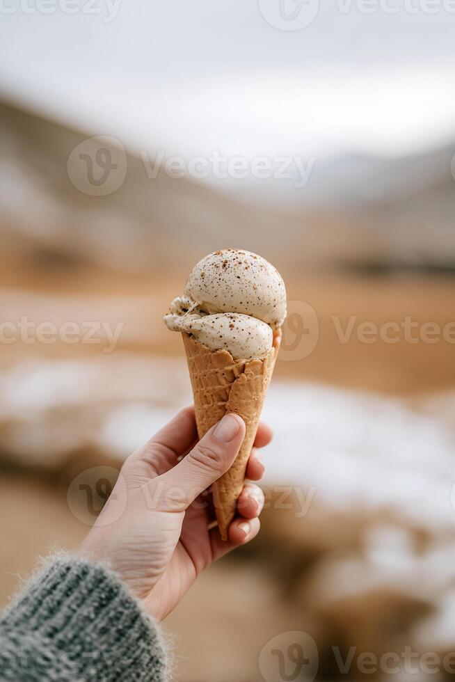 Ice cream cone in hand photo