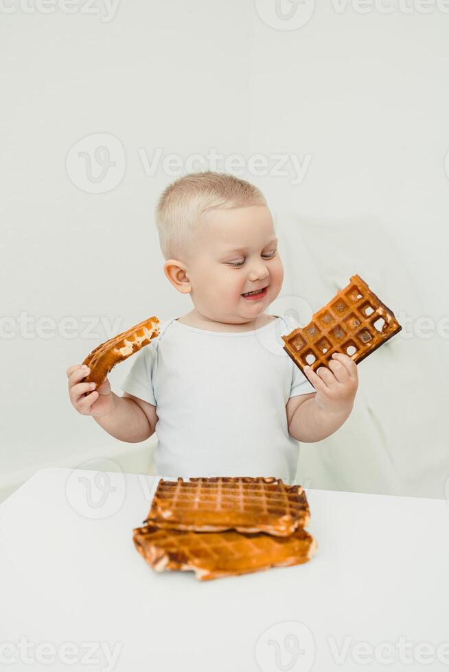 A Joyful Toddler with Waffles This delightful photo beautifully captures those precious snack moments that showcase the pure innocence and boundless happiness found in both childhood and family life
