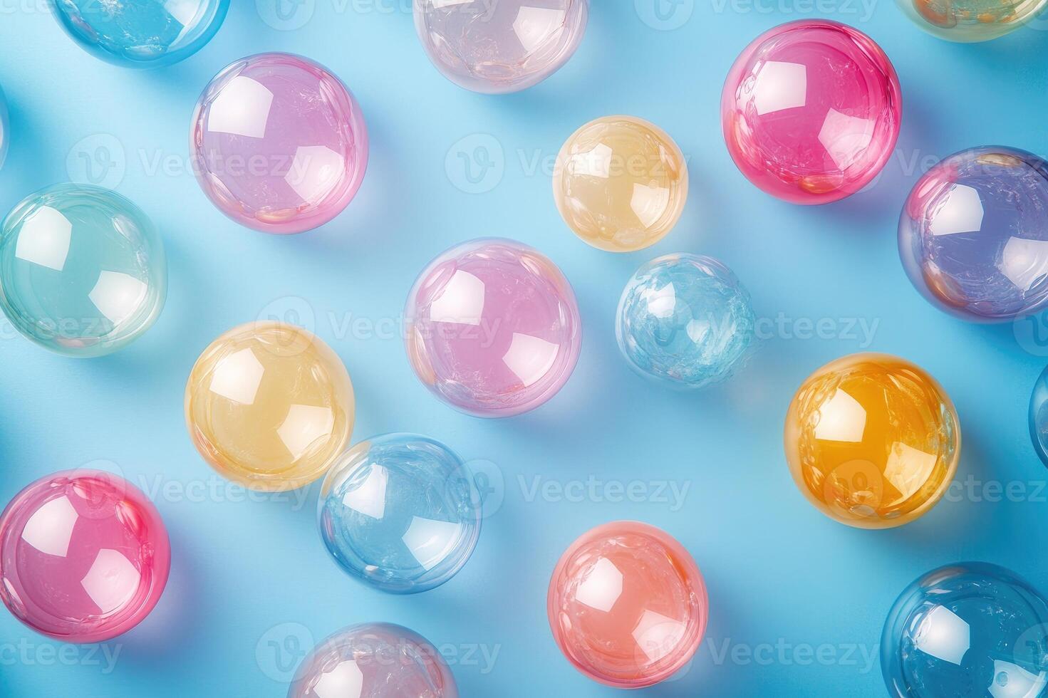 Colorful water beads creating an abstract pattern on blue background photo
