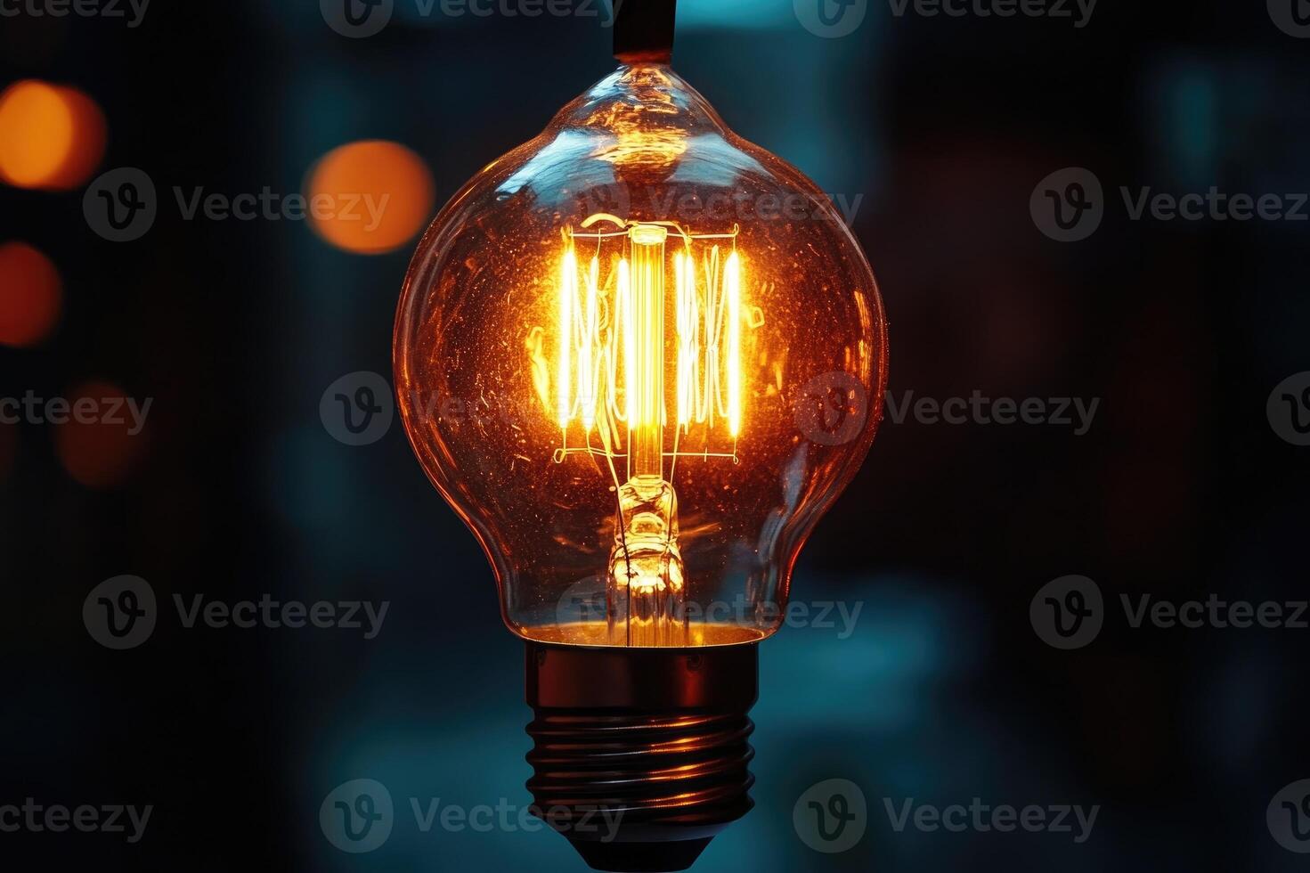 Bright light bulb shining in the dark, creating warm atmosphere photo