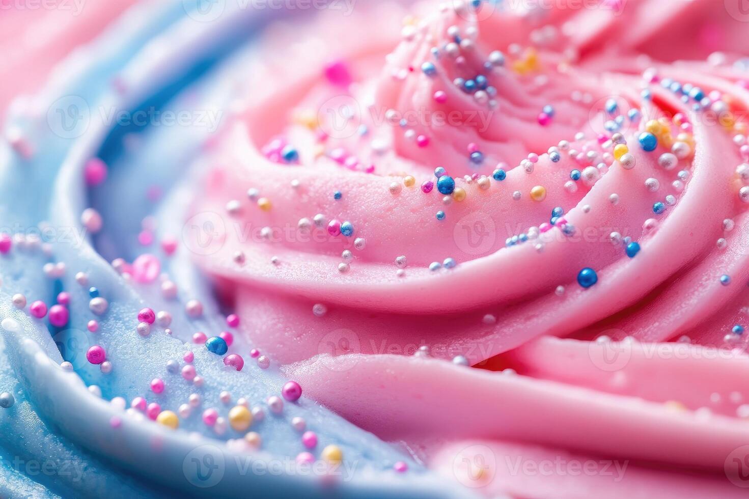 Delicious pink and blue frosting swirls decorated with colorful sprinkles photo
