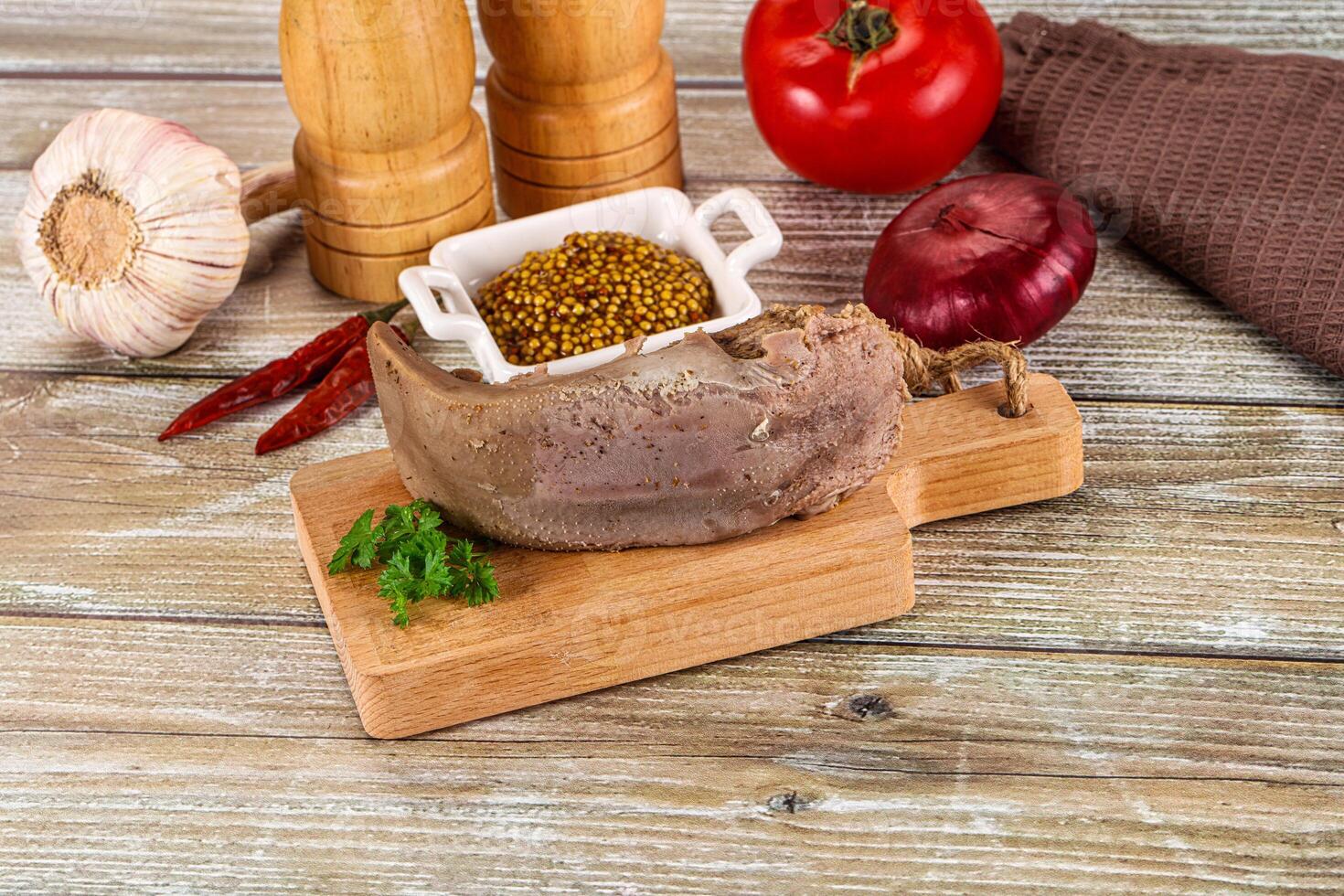 A meat and spices on a cutting board photo