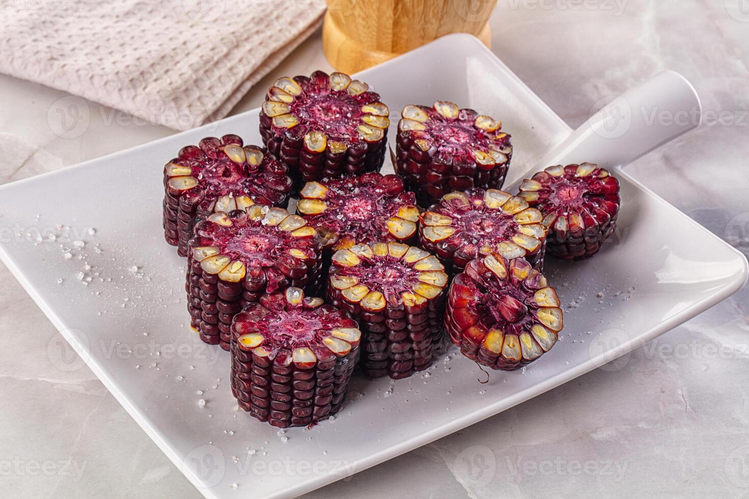 A plate with some red corn on it photo
