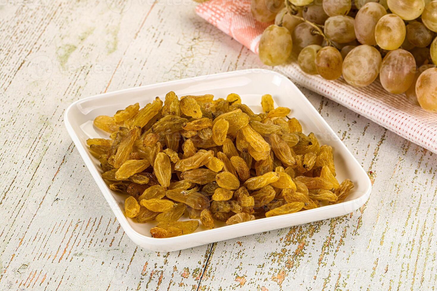 A white dish with grapes photo