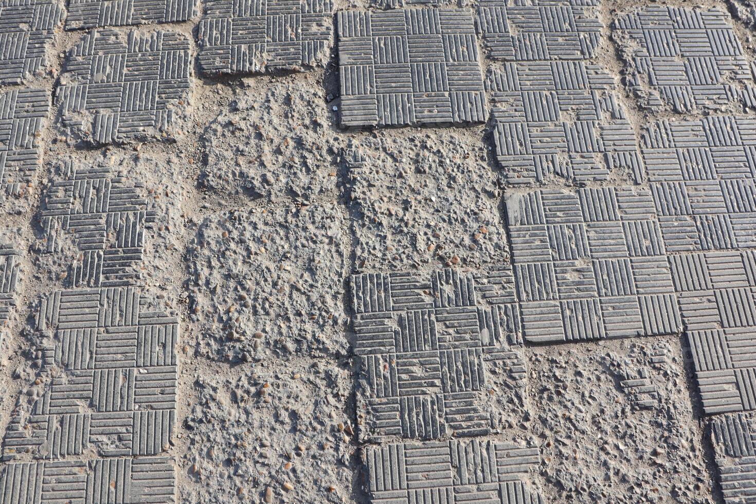 Detailed overview of Textured Pavement that exhibits various Wear and Tear Patterns photo